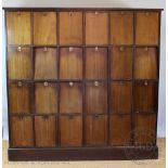 An early 20th century walnut solicitors bank of cabinets,