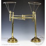 A pair of Edwardian style articulated brass desk lamps,