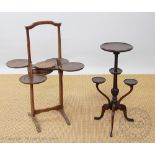 An Edwardian oak four tier folding cake stand, 75cm H,