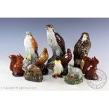 A collection of Beswick birds and animals comprising; osprey flask, buzzard flask,