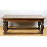 A 17th century style oak refectory type table,