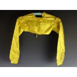 Two early 19th century canary yellow silk spencers,