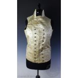 An early 19th century double breasted cream satin waistcoat with sprigged embroidery and metallic