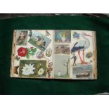 A Victorian scrapbook containing very well preserved examples of seasonal cards and cutouts from the