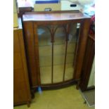 A walnut display cabinet.