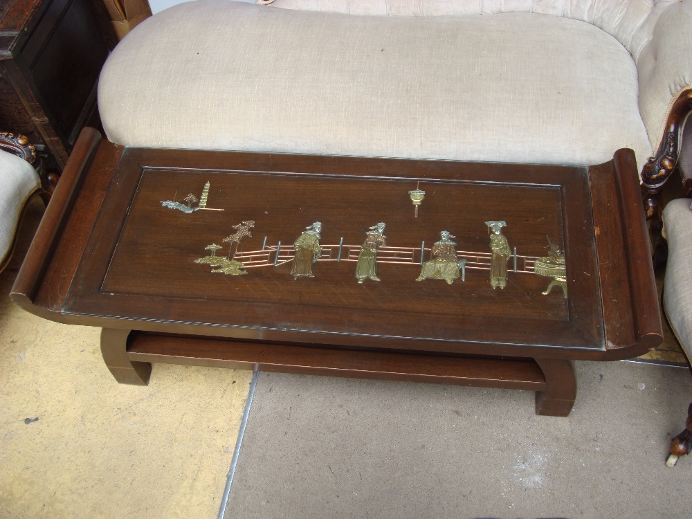 A glass inset two tier coffee table featuring a Chinese scene made of brass, copper and white - Image 2 of 2