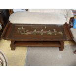 A glass inset two tier coffee table featuring a Chinese scene made of brass, copper and white