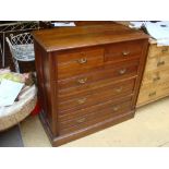 An Edwardian walnut chest of drawers.