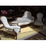 A Salon suite comprising a chaise longue, a gentlemans chair and a ladies chair, all upholstered