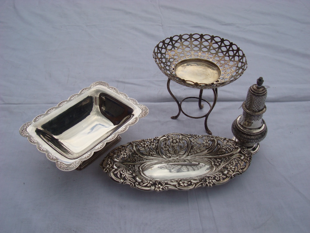 A silver sweet dish on three legs, Chester, 1906 by James Deakin & Sons together with a silver sugar