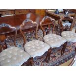 A set of four Victorian balloon back bedroom chairs, with carved back on cabriole legs, 89cm high (