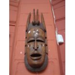 An African ornamental mask, approx 81cm high.