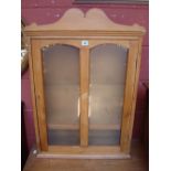A pine display cabinet, with key. 63 x 21 x 91cm high.
