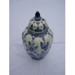 A Delft blue and white hand painted vase with lid.