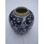 A Chinese blue and white ginger jar, decorated with flowers.