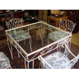 A cast iron framed glass topped table together with four matching chairs with cushions, 92 x 92 x