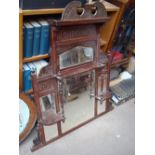 An early 20th Century wooden shelved overmantle mirror, consisting of 6 bevelled glass sections.