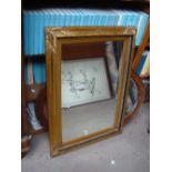 A gilt framed rectangular wall mirror. 96 x 71 cm.