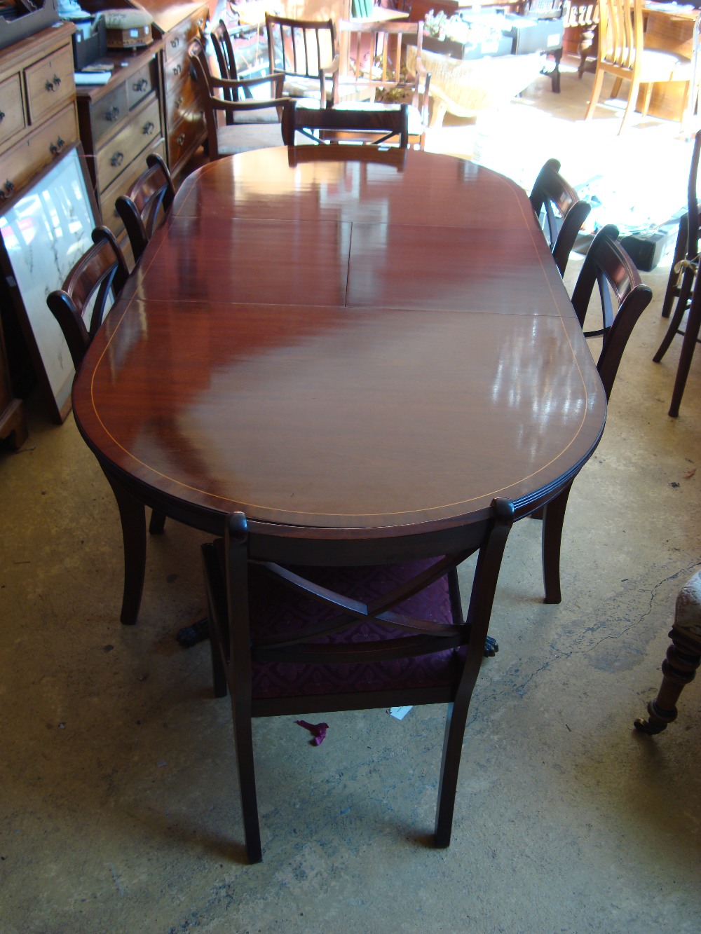 A reproduction mahogany twin pedestal dining table together with six chairs.