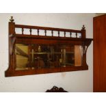 An Edwardian inlaid overmantle mirror.