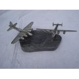 Two model aluminium wartime aeroplanes (Lancaster) by D.P Carter. On marble base with rotation