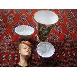 A small mixed lot comprising a wall mask by B. Collins, two jelly moulds and a green and orange