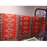 Four small Pakistan style runners, each approx 98 x 41cm.