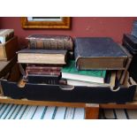 A mixed lot of leather bound Bibles together with other Religious books.