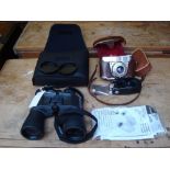 A pair of cased Asahi Pentax 10 x 50 binoculars, along with a cased Kodak Reinette 1A camera with