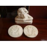 A small marble bust of a young girl on plinth base together with two relief roundels after the