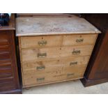 A pine chest of drawers.