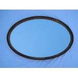 An oval mirror (small amount of loss). 95cm wide.