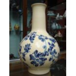 A poss Chinese baluster vase decorated with blue flowers on a cream ground.
