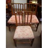 A set of three George III elm country dining chairs, with curved square backs and moulded upright