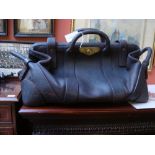 A vintage brown leather bank bag with carrying handles, inscription on Hobbs & Co lock L.C.W & P