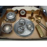A mixed lot of metalware to include two brass candlesticks, a pewter tea service, a silver plated