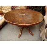 An Edwardian walnut loo table.