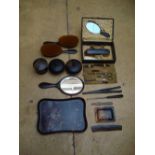 Various tortoiseshell patterned grooming items to include hand mirrors, brushes, a grooming kit