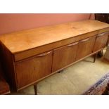 A Danish Austinsuite sideboard, with four drawers over four cupboards, 198 x 48 x 79cm high (stain