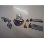 A tanzanite pendant, stamped 925; a tanzanite ring, marked 925, size R1/2; a pair of 9k gold
