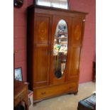 An inlaid single door Edwardian wardrobe.