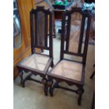 A pair of Queen Anne style chairs.