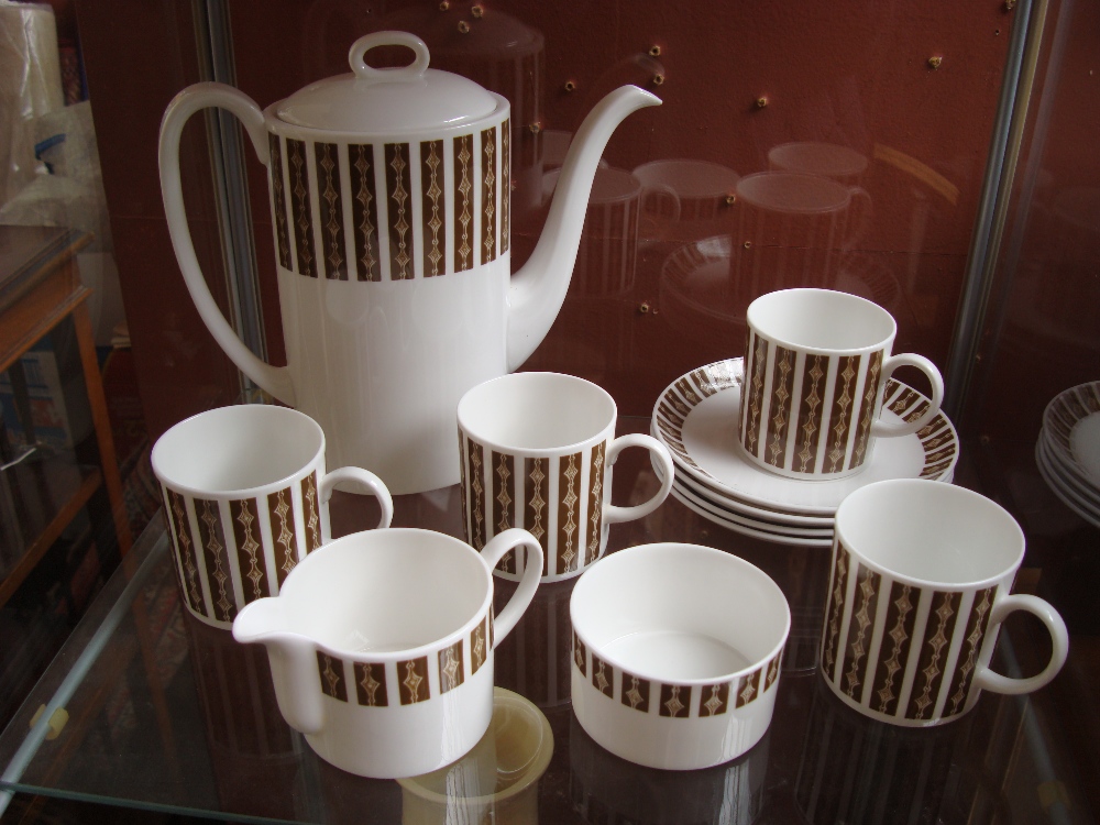 A Susie Cooper Wedgewood 'Saturn' coffee set, comprising of a coffee pot with lid, four coffee cups,