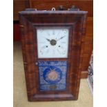 E N Welch USA.  An ogee 'Improved Thirty Hour' wall clock, with Civil War decorated glass door, a/f.