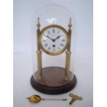 An early 20th Century French gilt brass Portico clock, the circular white enamel dial with Roman