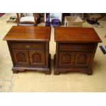 A pair of American Thomasville cherrywood bedside tables, each with a drawer above a pair of