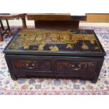 A modern gilt chinoiserie and black lacquer low rectangular coffe table, with two drawers. 91cm wide