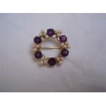 A 9ct gold set cultured pearl and amethyst open circular cluster brooch, Birmingham 1975,