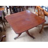 A mahogany tilt top breakfast table.