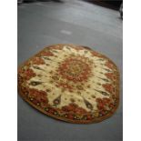 An Ovode cream ground rug. 298 x 200cm.